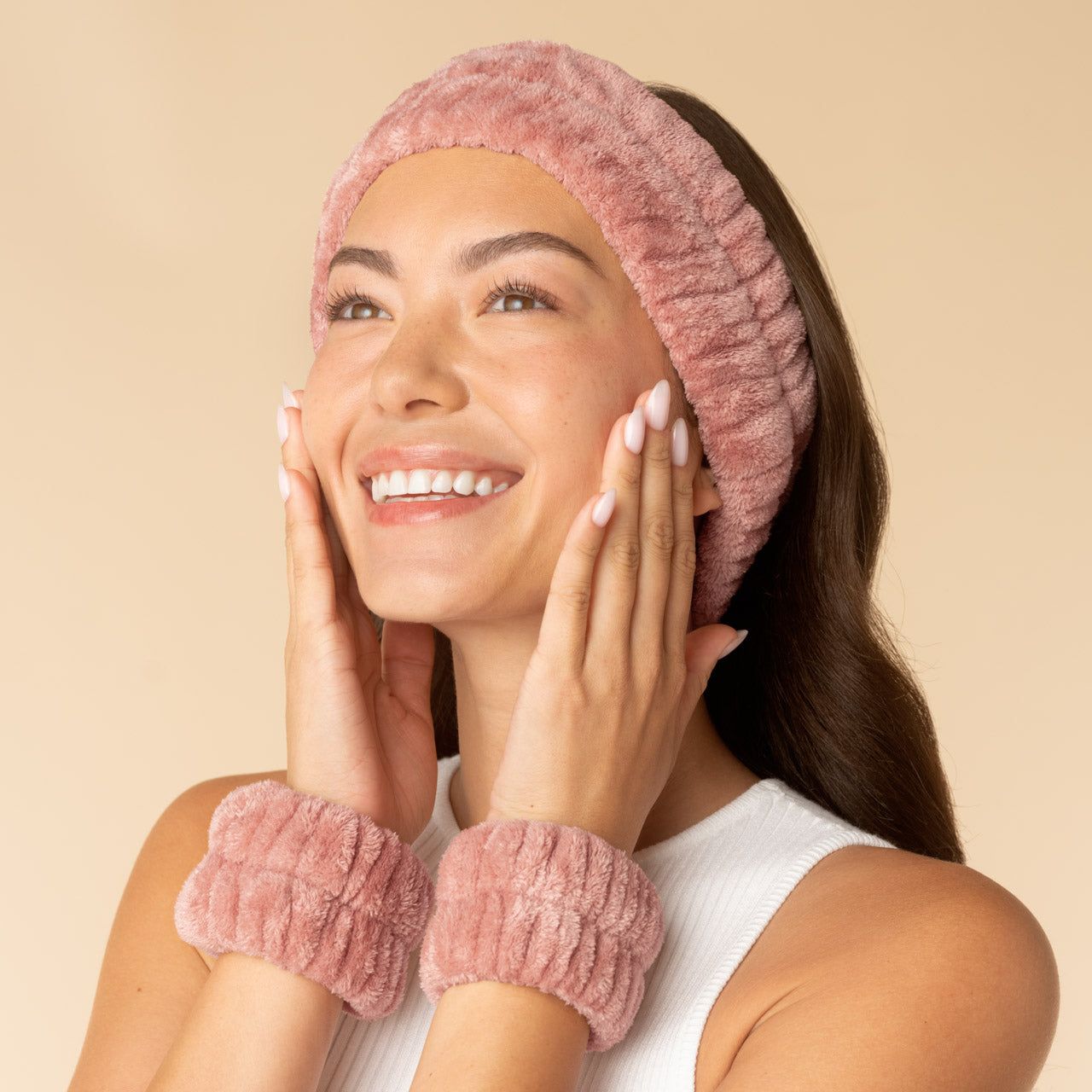 Woman wearing the Terracotta Kitsch Spa Headband and Wristlets 3pc Set during her skincare routine to keep hair and sleeves dry.