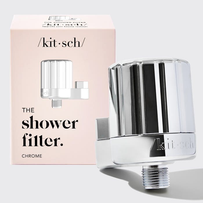 Chrome shower filter with 'kit·sch' branding and packaging on a light gray background