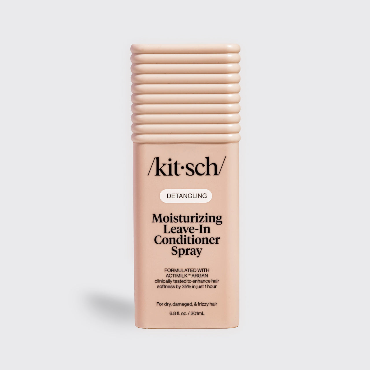 Kitsch Moisturizing Leave-In Conditioner Spray in blush packaging for dry, damaged, and frizzy hair, formulated with Actimilk™ Argan.
