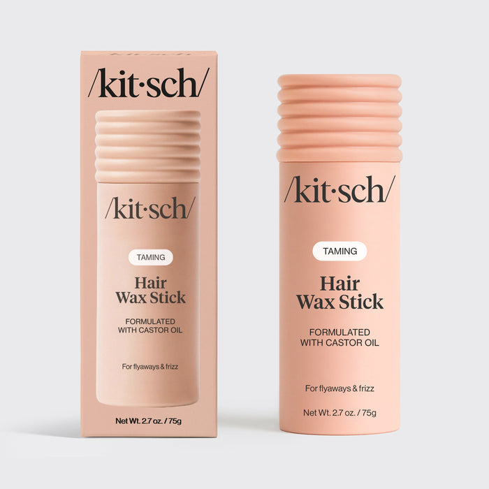 KITSCH Hair Wax Stick — hero product shot on light gray background — two TAMING Hair Wax Stick Formulated With Castor Oil — one with retail box packaging, one standalone stick — For flyaways & frizz — Net Wt. 2.7 oz / 75g — 100% vegan & plant-based wax enriched with nourishing castor oil — All-day hold without texture or greasiness