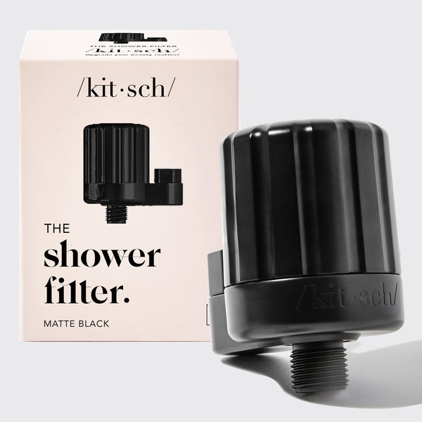 Kitsch Black Shower Filter with packaging on a light gray background