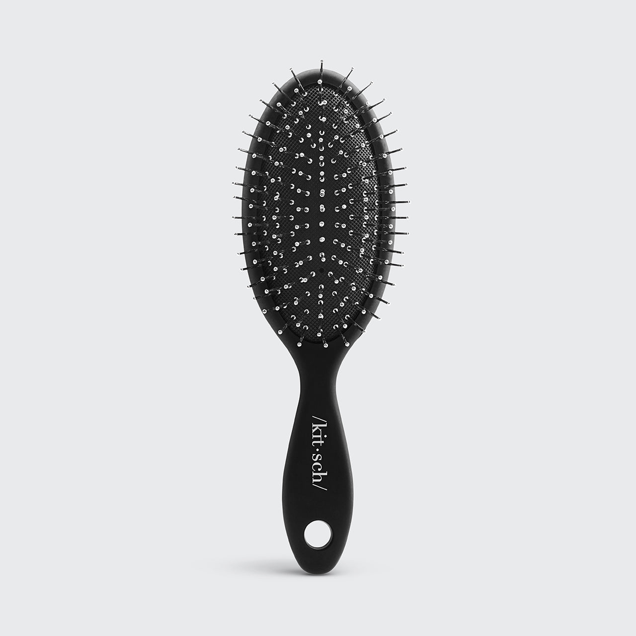 Mini spazzola per capelli da viaggio con setole metalliche create consapevolmente