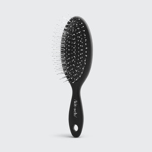 Mini spazzola per capelli da viaggio con setole metalliche create consapevolmente