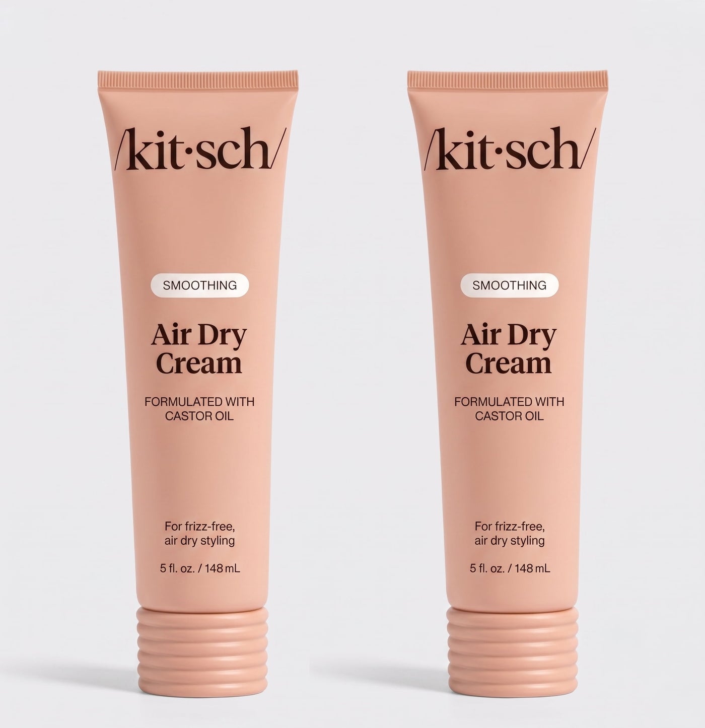 Two tubes of Kitsch Smoothing Air Dry Cream formulated with castor oil, 5 fl. oz. (148 mL), displayed side by side on a white background for frizz-free, air-dry styling.