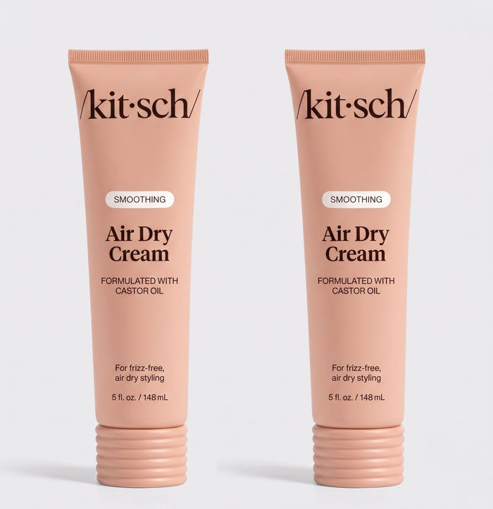 Two tubes of Kitsch Smoothing Air Dry Cream formulated with castor oil, 5 fl. oz. (148 mL), displayed side by side on a white background for frizz-free, air-dry styling.