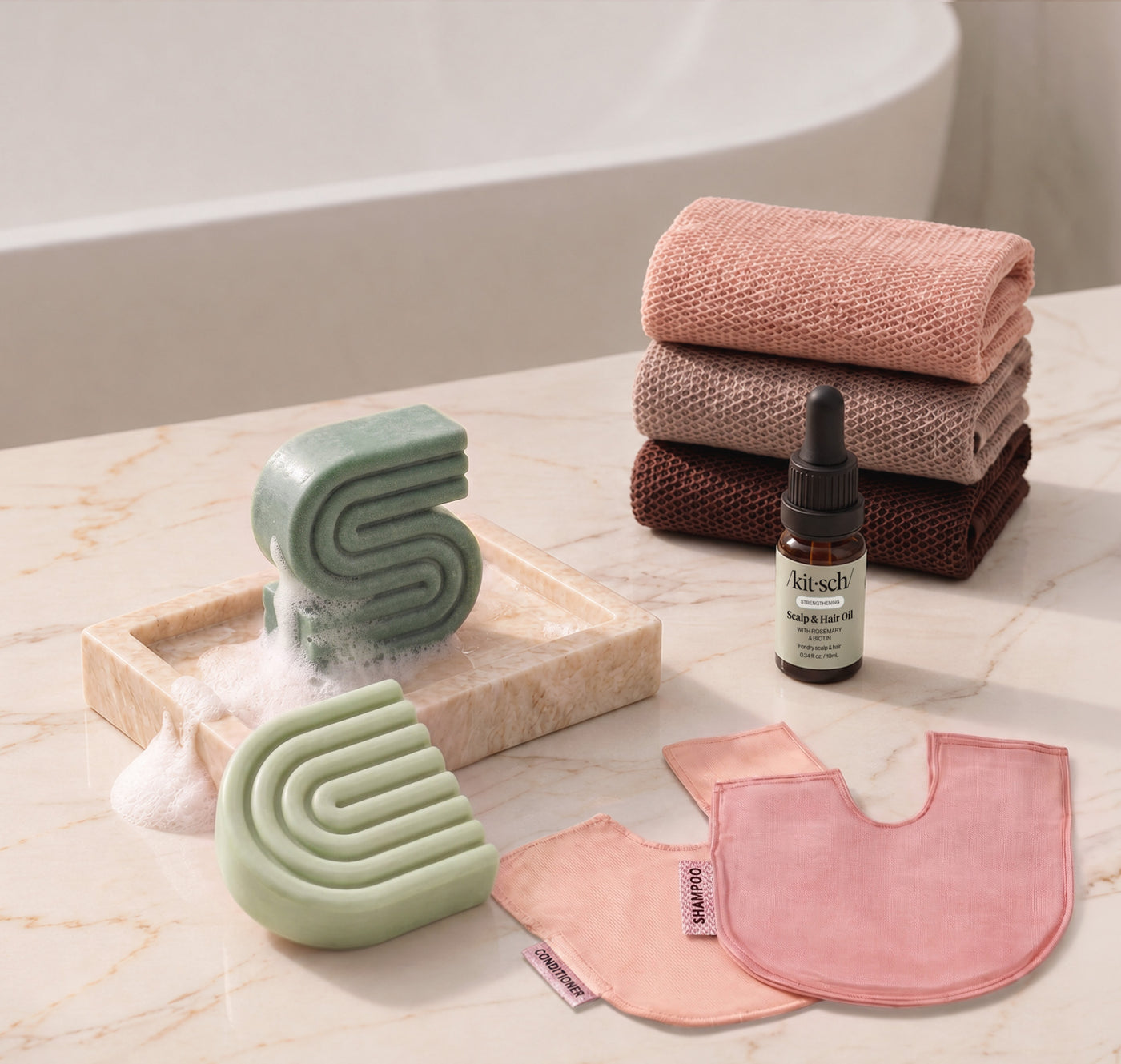 Rosemary & Biotin: Kitsch Winter Welcome Kit with Rosemary & Biotin shampoo and conditioner bars, Rosewood African Net Sponge, shampoo and conditioner bar bags, and Rosemary & Biotin Scalp & Hair Oil.